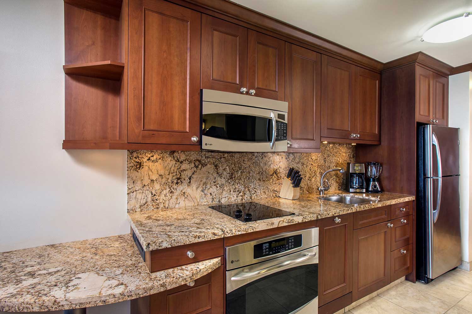 Spacious living area with seating and ocean views in Puna II suite