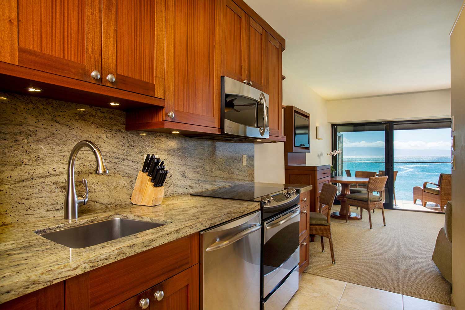 Oceanfront bedroom with sliding doors and private lanai view