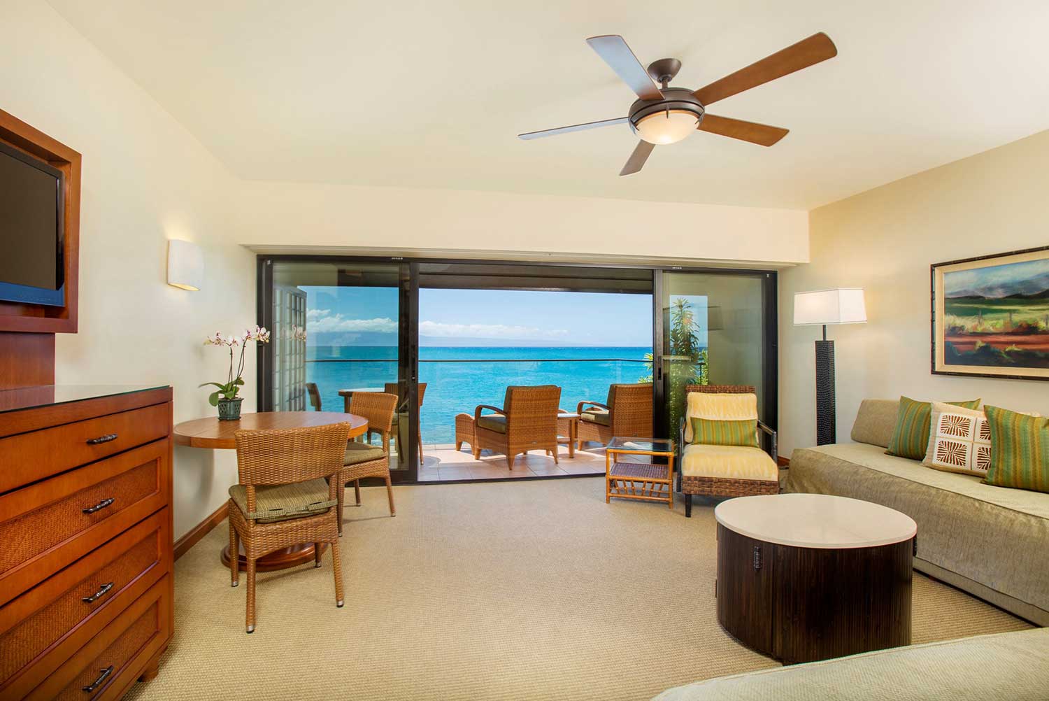 Private oceanfront lanai with seating overlooking the ocean